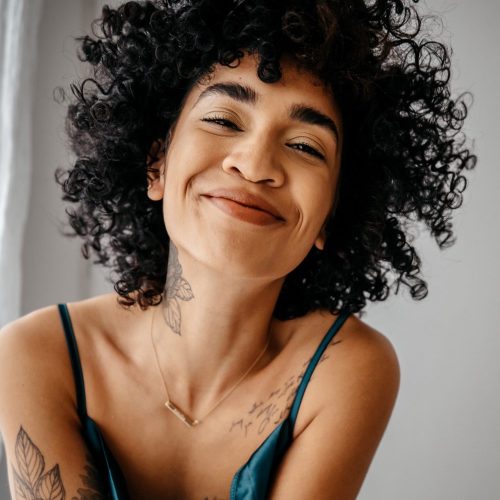 Smiling, relaxed, confident woman. Nutrition with Nina services: Digestive MOT
