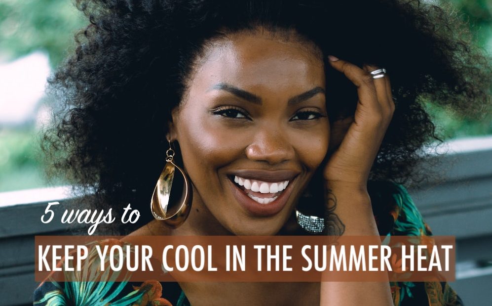 Young black woman, smiling, direct to camera, looking cool
